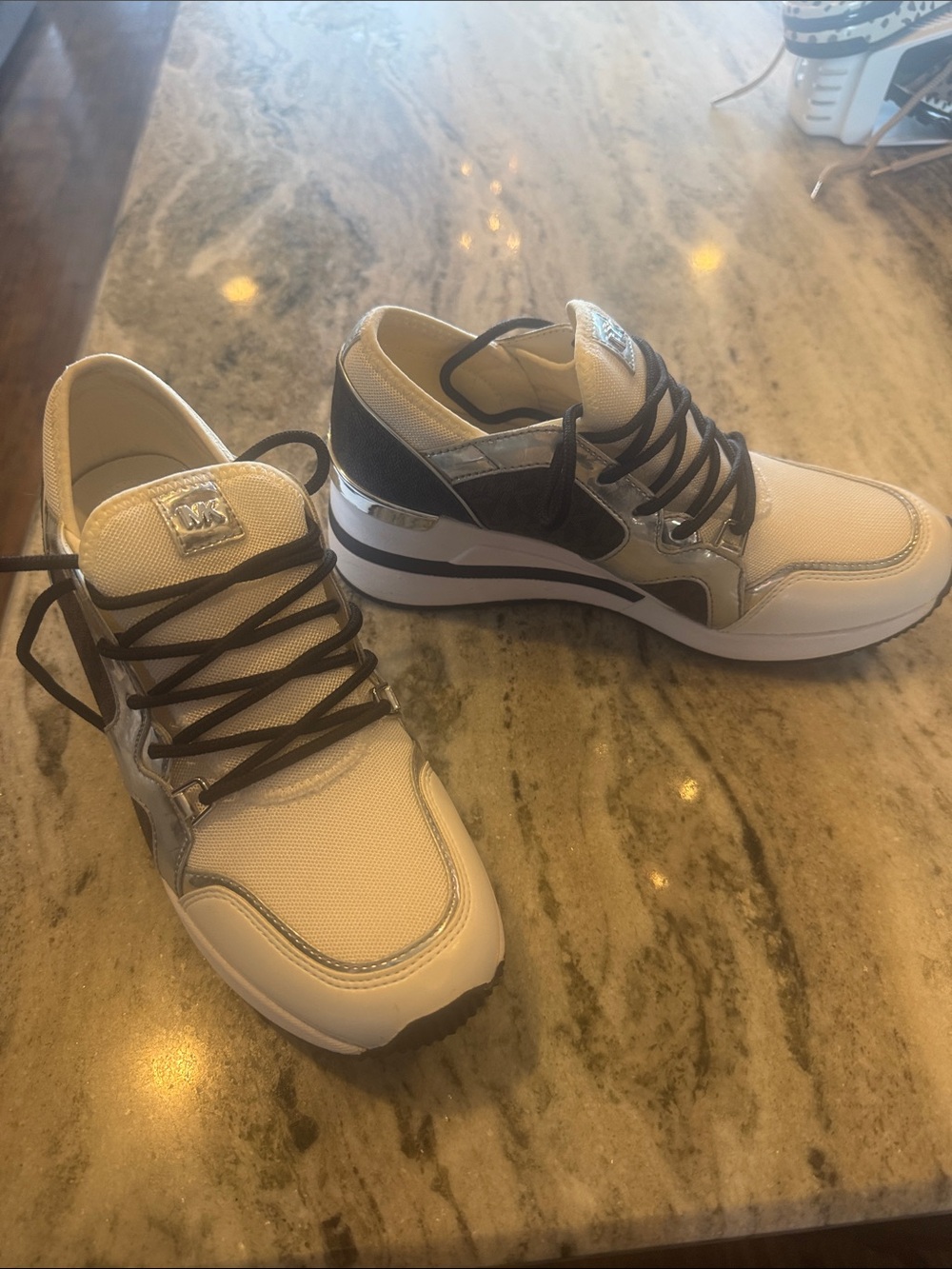 Michael Kors women’s White and Silver Low-Top Sneakers